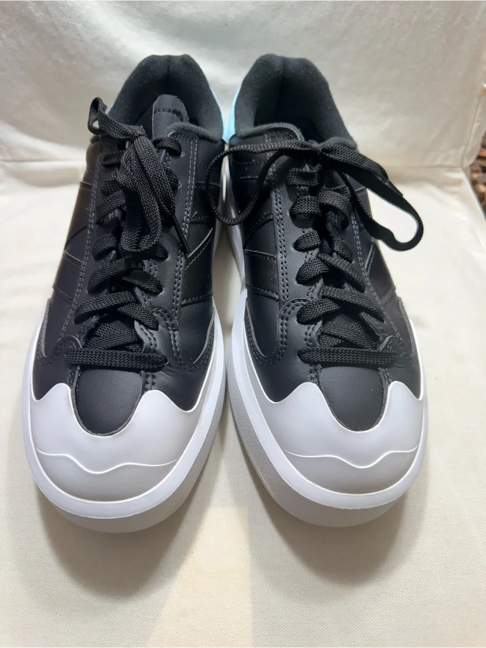 New Balance - Black and White Women's Leather Sneakers with Light Blue Accent